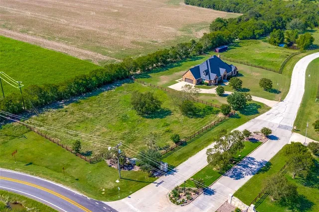 a view of a swimming pool with a yard