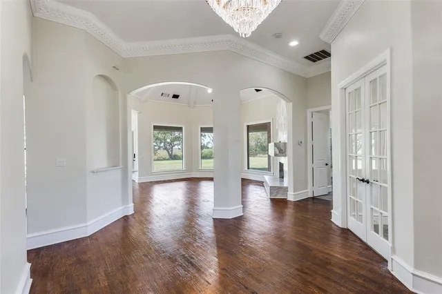 a view of an entryway with wooden floor