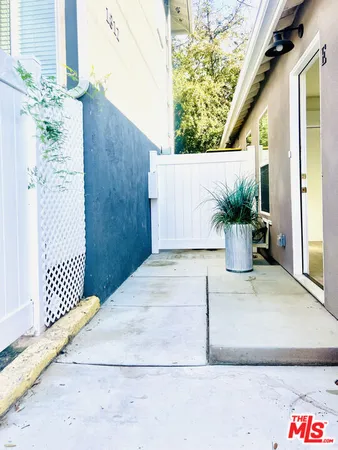 a potted plant sitting on the side of a building