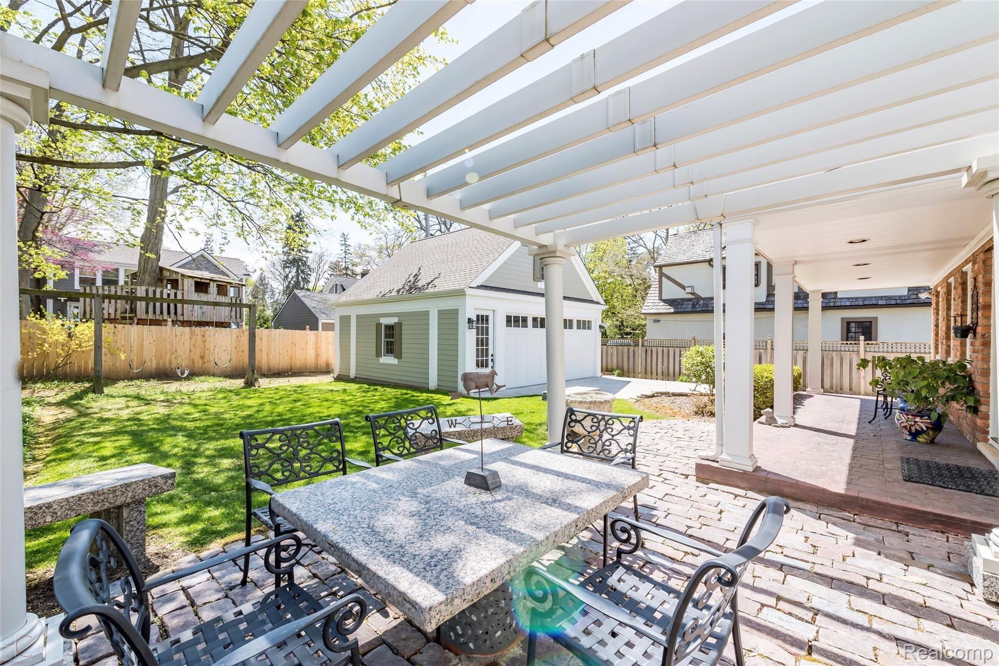 540 Rivenoak Street Birmingham, MI 48009 - Photo 28 of 34 Tranquil Patio With Custom Granite Table & Benches & Very Cool Reclaimed Detroit Road Bricks