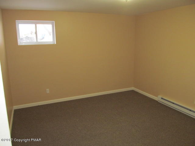 334 Canterbury Road Bushkill, PA 18324 - Photo 16 of 20 a view of a small space with wooden floor and a window