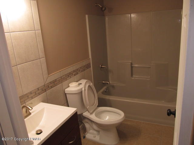 334 Canterbury Road Bushkill, PA 18324 - Photo 18 of 20 a white toilet sitting next to a bath tub