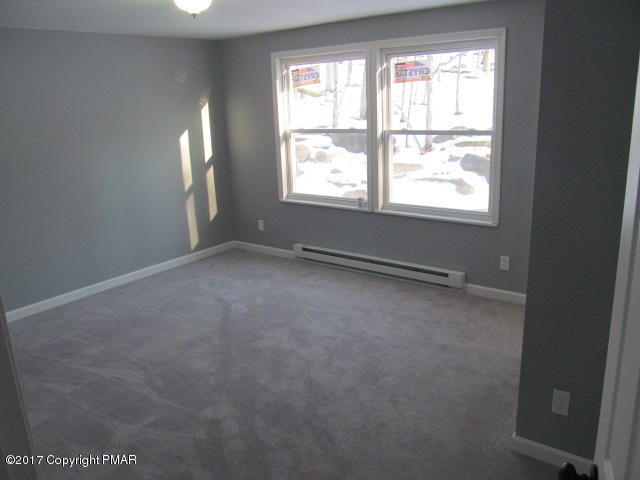 334 Canterbury Road Bushkill, PA 18324 - Photo 6 of 20 an empty room with windows