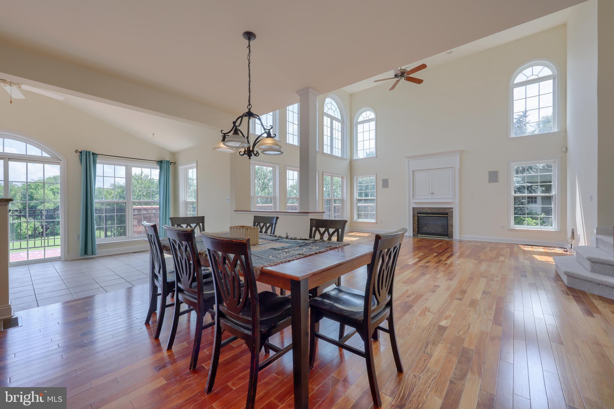 18183 Piedmont Road Stewartstown, PA 17363 - Photo 16 of 81 a view of a dining room with furniture window and wooden floor