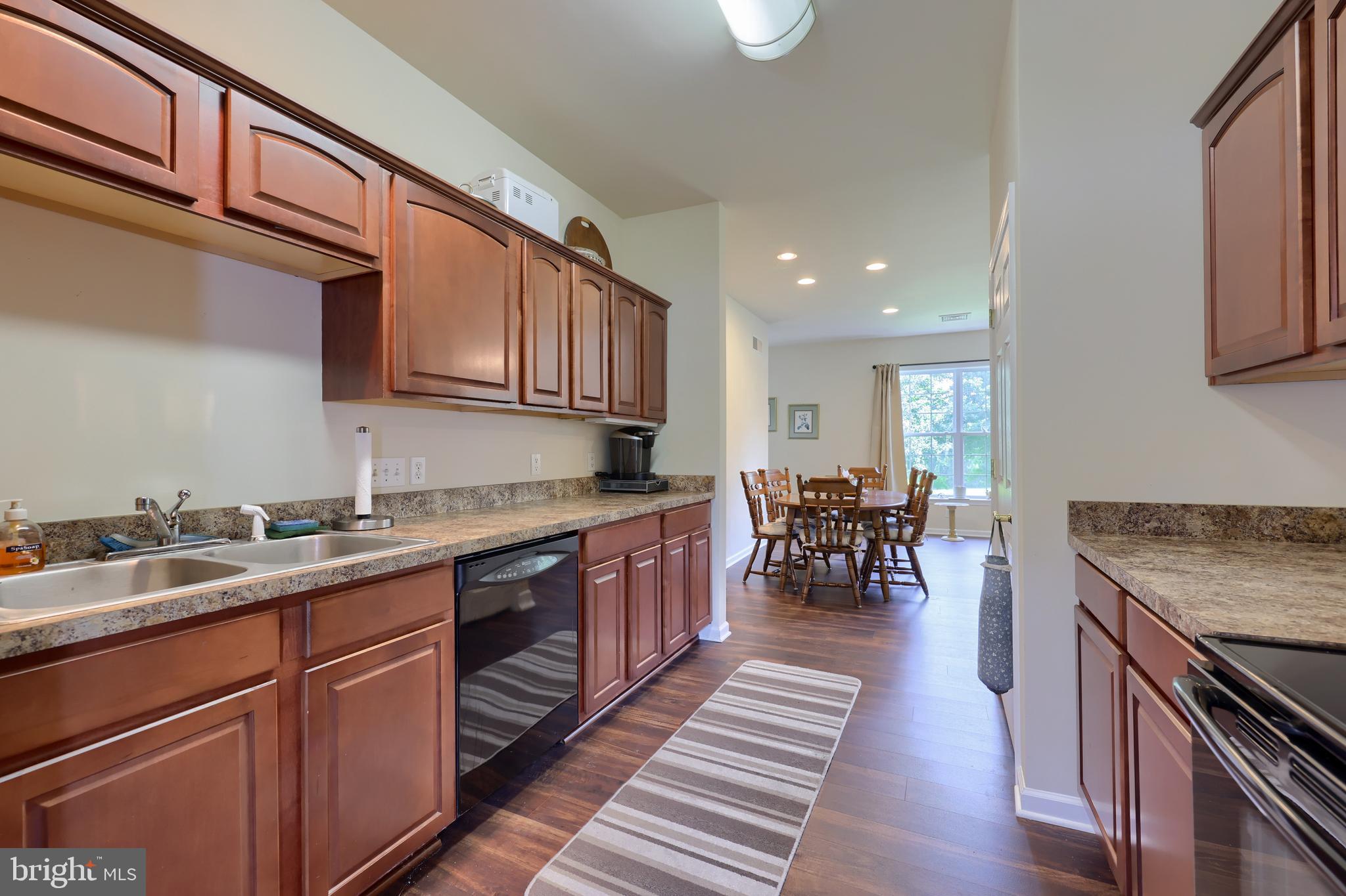 18183 Piedmont Road Stewartstown, PA 17363 - Photo 74 of 81 a kitchen with lots of counter space a sink appliances and cabinets