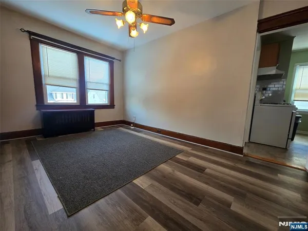 a view of room with window and ceiling fan