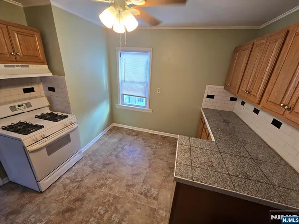 a view of kitchen sink and stove