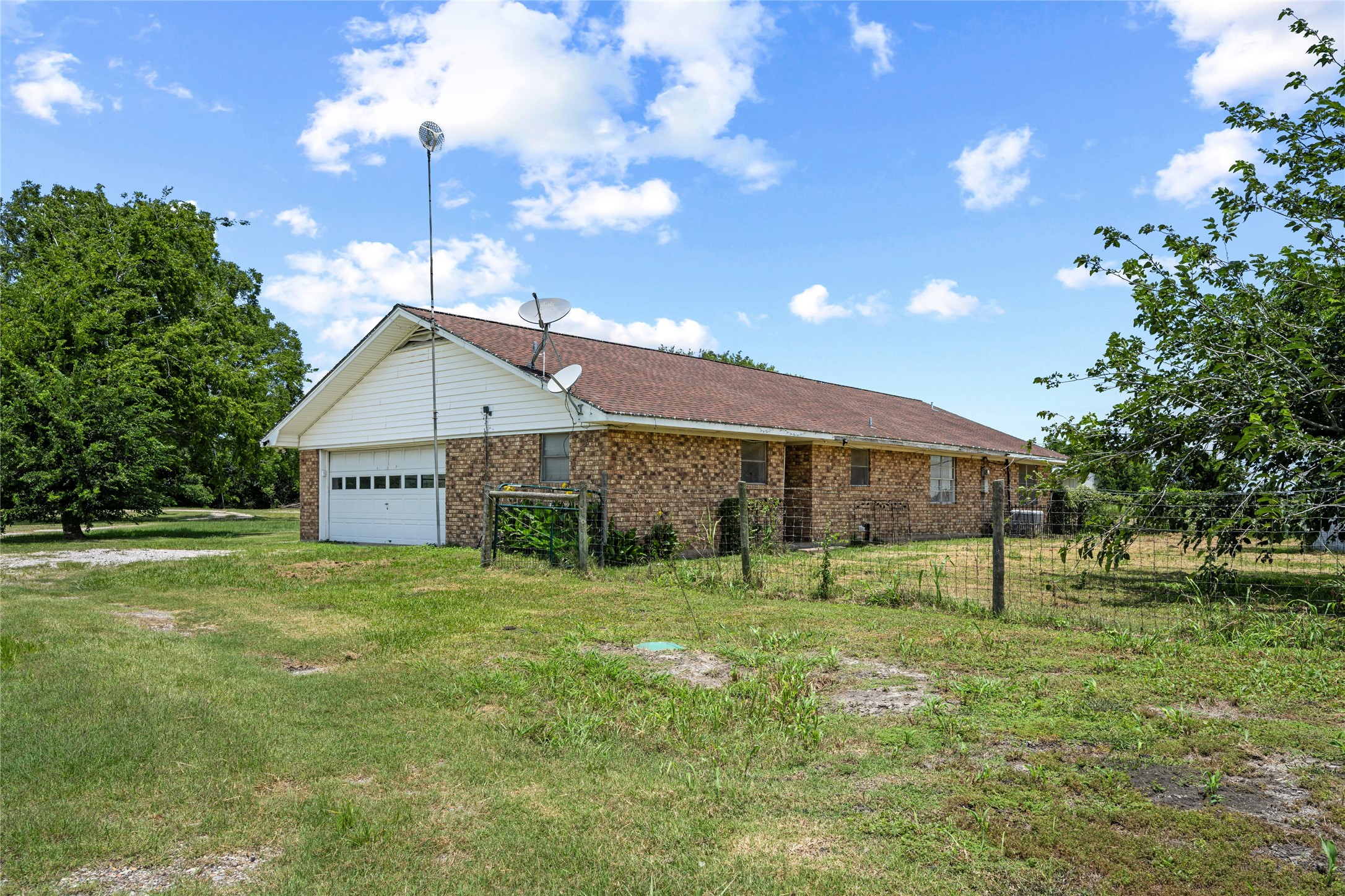 2623 Salem Road Brenham, TX 77833 - Photo 5 of 24 Garage Side View/Back Yard