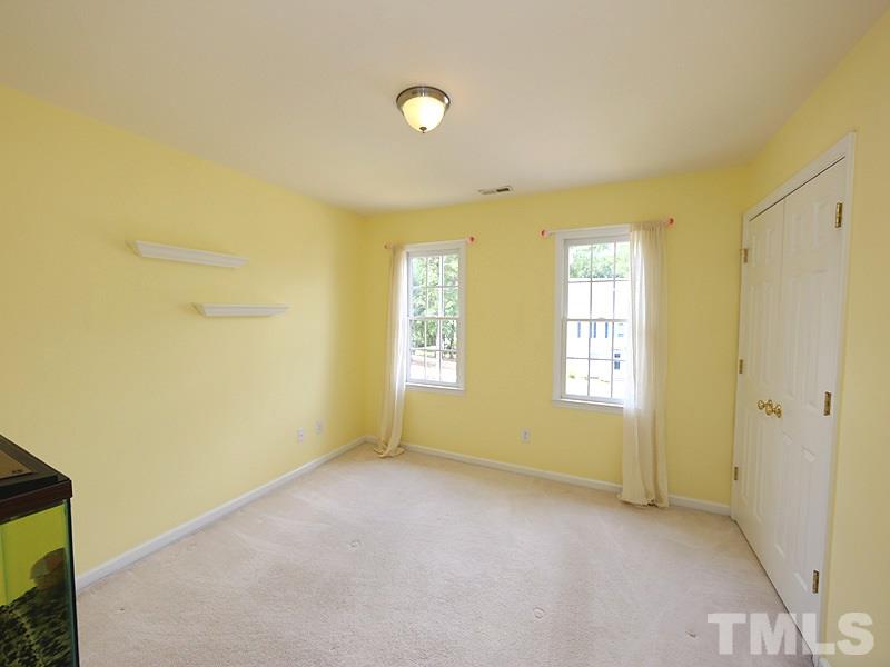 2608 Westmill Court Raleigh, NC 27613 - Photo 14 of 21 This sunny bedroom has large, built in closet.