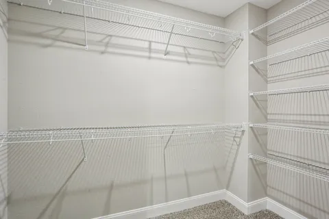 a white toilet sitting in a bathroom