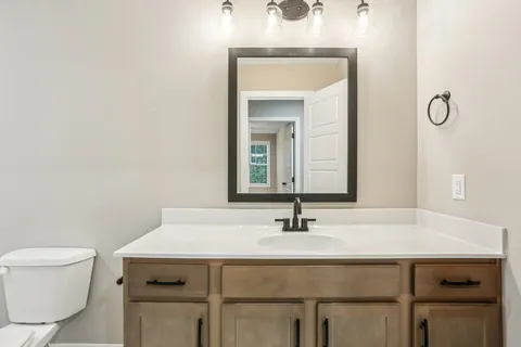 a bathroom with a toilet and a bathtub