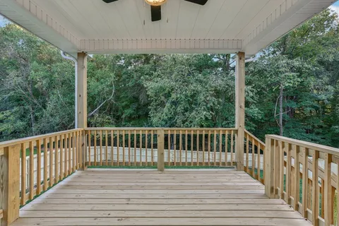 a view of balcony with wooden floor