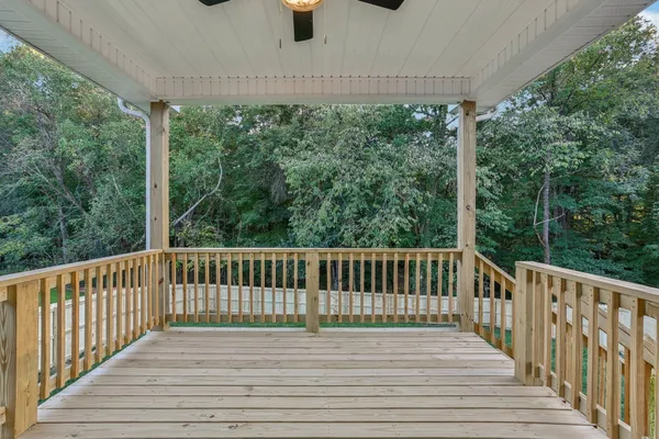 a view of balcony with wooden floor