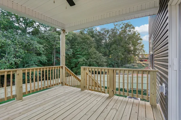 a view of a balcony with wooden floor