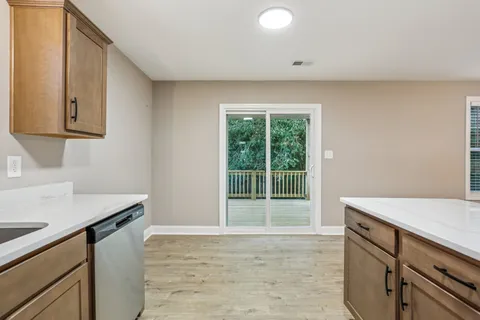 a kitchen with a sink cabinets and a stove