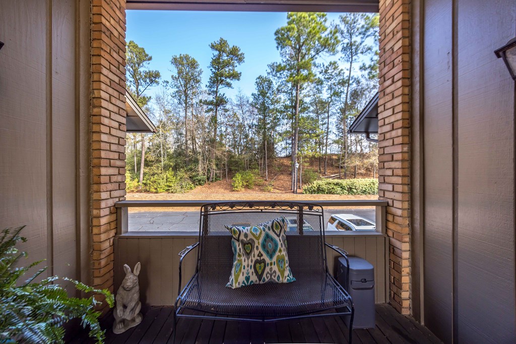 6500 Standing Boy Road, Unit 24 Columbus, GA 31904 - Photo 20 of 23 a wooden bench sitting in front of a door