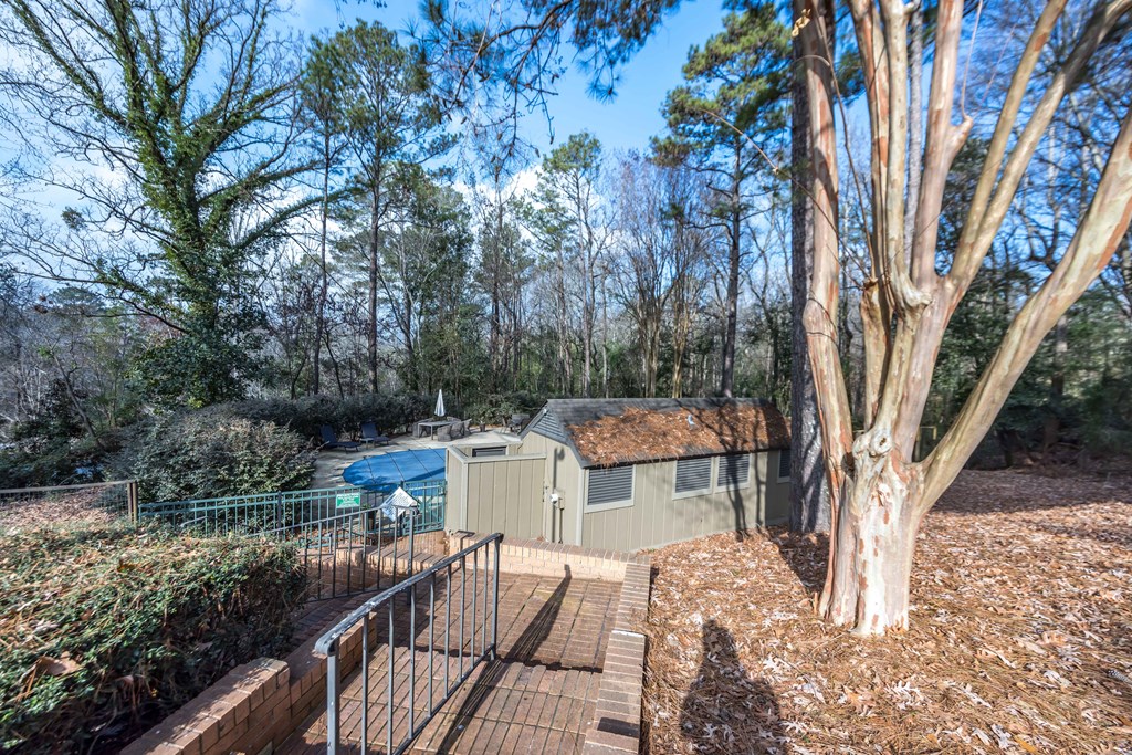 6500 Standing Boy Road, Unit 24 Columbus, GA 31904 - Photo 21 of 23 a view of backyard with seating space and trees