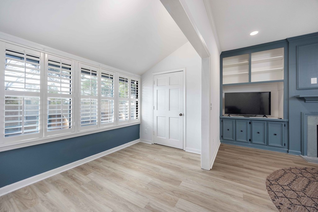 6500 Standing Boy Road, Unit 24 Columbus, GA 31904 - Photo 6 of 23 a view of a bedroom with cabinet flat screen tv and windows
