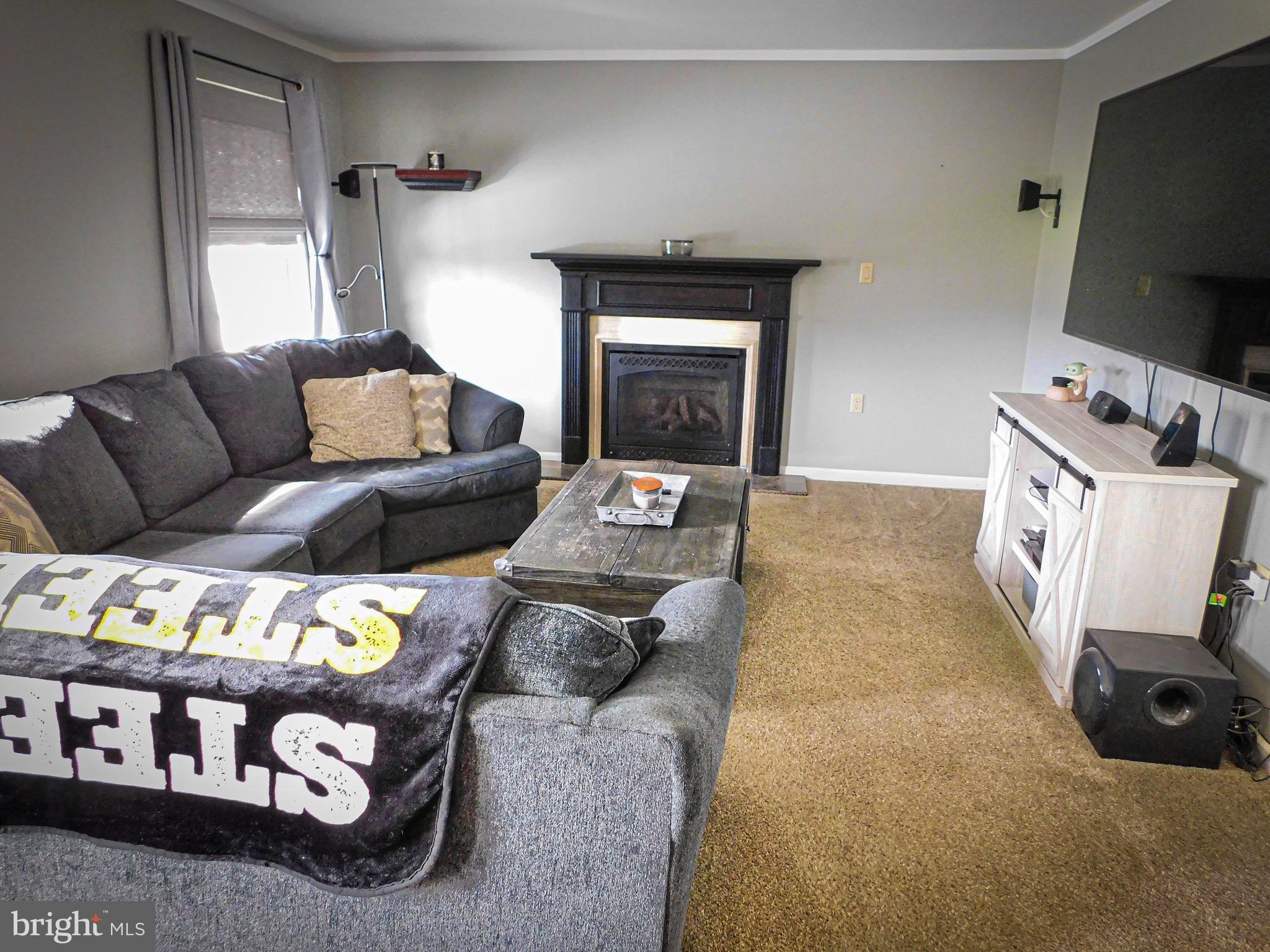1114 West Springfield Drive Bellefonte, PA 16823 - Photo 11 of 43 a living room with furniture and a flat screen tv