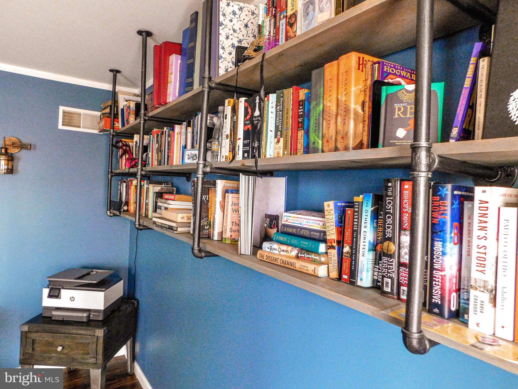 1114 West Springfield Drive Bellefonte, PA 16823 - Photo 17 of 43 a view of book shelf with clothes and shoes