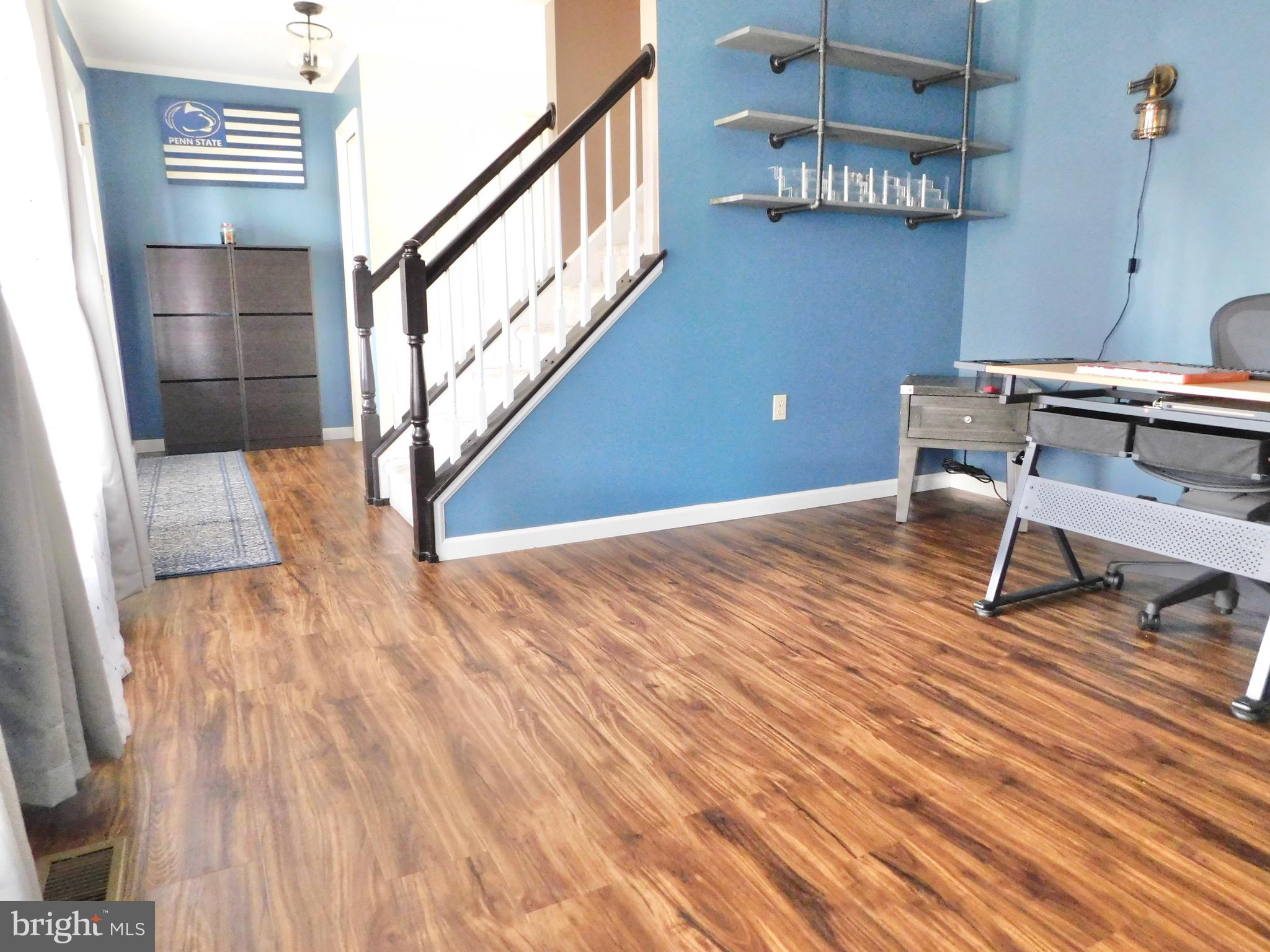 1114 West Springfield Drive Bellefonte, PA 16823 - Photo 18 of 43 a view of a room with wooden floor and chair