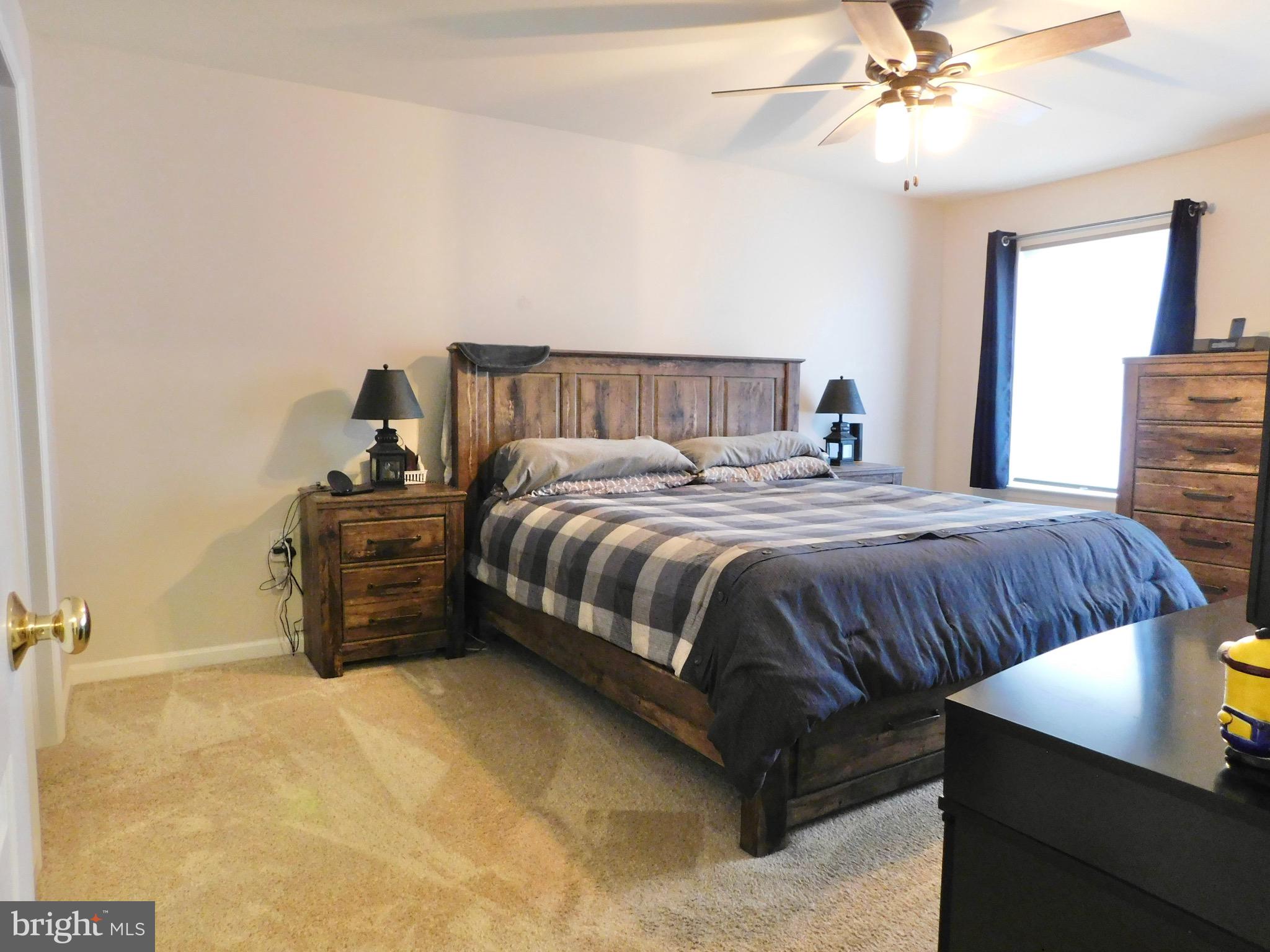 1114 West Springfield Drive Bellefonte, PA 16823 - Photo 19 of 43 a bedroom with a bed and ceiling fan