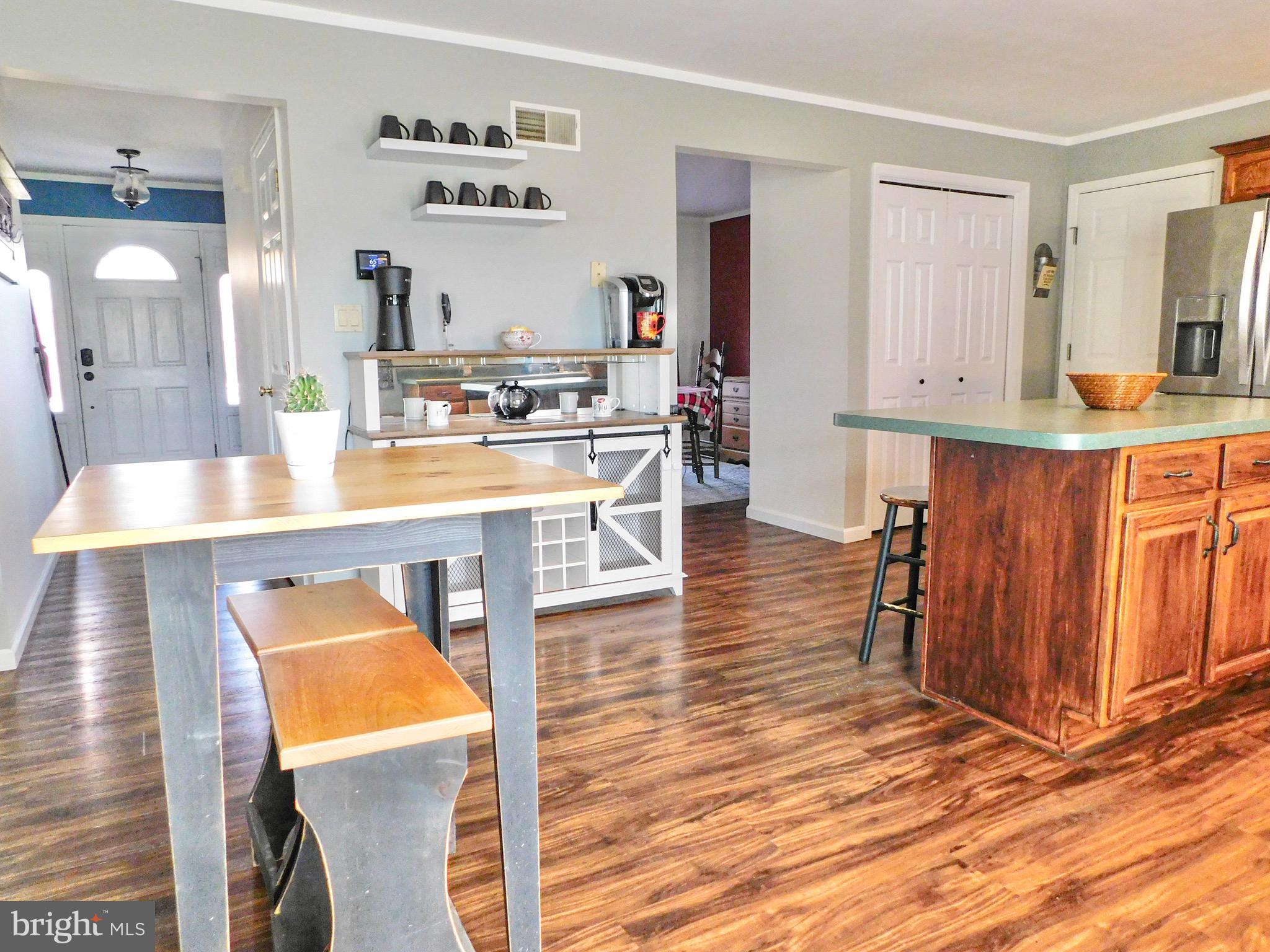 1114 West Springfield Drive Bellefonte, PA 16823 - Photo 9 of 43 a view of kitchen island with furniture and wooden floor
