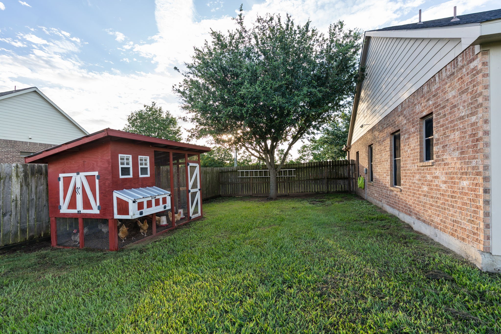 5942 Wildflower Road Sealy, TX 77474 - Photo 29 of 41 a view of a back yard of the house