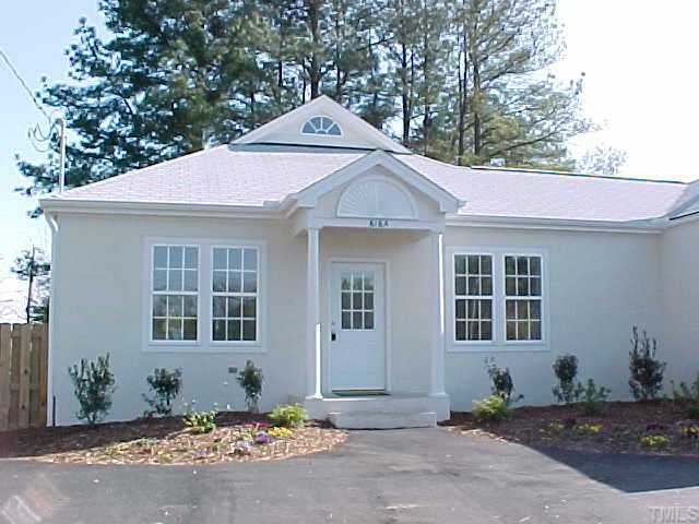 616 East Whitaker Mill Road, Unit A Raleigh, NC 27608 - Photo 1 of 1 a front view of a house with a yard and garage