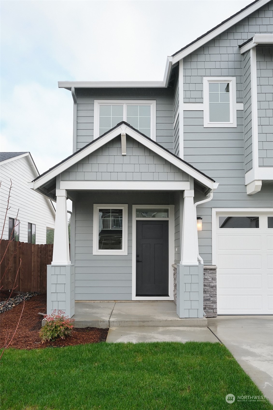 708 Cardinal Avenue Winlock, WA 98596 - Photo 2 of 28 a front view of a house with a yard