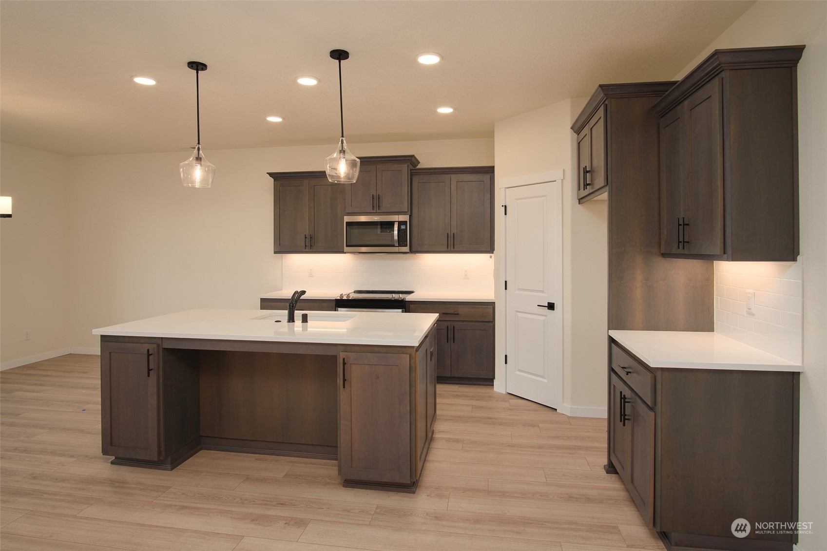 708 Cardinal Avenue Winlock, WA 98596 - Photo 7 of 28 a view of kitchen with stainless steel appliances granite countertop a sink a refrigerator and a stove