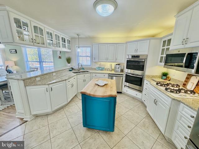 1234 Kelley Neck Road Lancaster, VA 22503 - Photo 19 of 71 a kitchen with stainless steel appliances granite countertop a stove top oven a sink dishwasher and a refrigerator