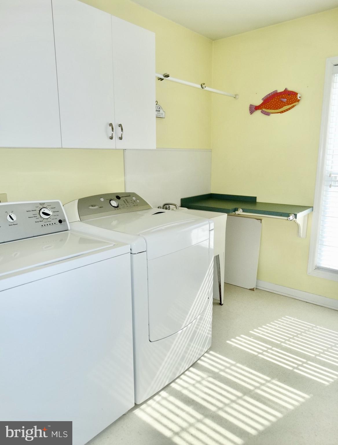 1234 Kelley Neck Road Lancaster, VA 22503 - Photo 25 of 71 a utility room with dryer and washer