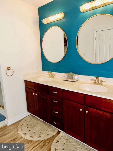 1234 Kelley Neck Road Lancaster, VA 22503 - Photo 31 of 71 a bathroom with a double vanity sink and a mirror