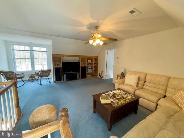 1234 Kelley Neck Road Lancaster, VA 22503 - Photo 40 of 71 a living room with furniture and a fireplace