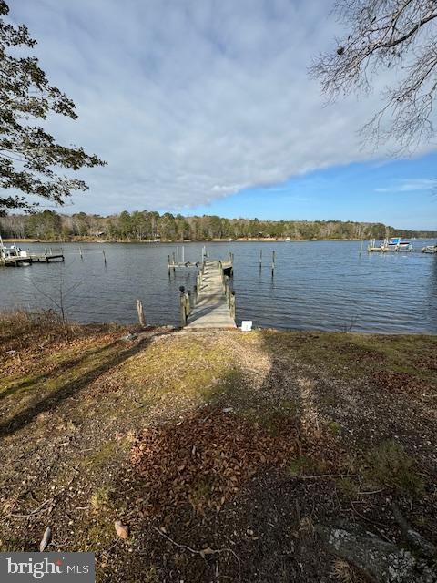 1234 Kelley Neck Road Lancaster, VA 22503 - Photo 56 of 71 a view of a lake with houses in the back