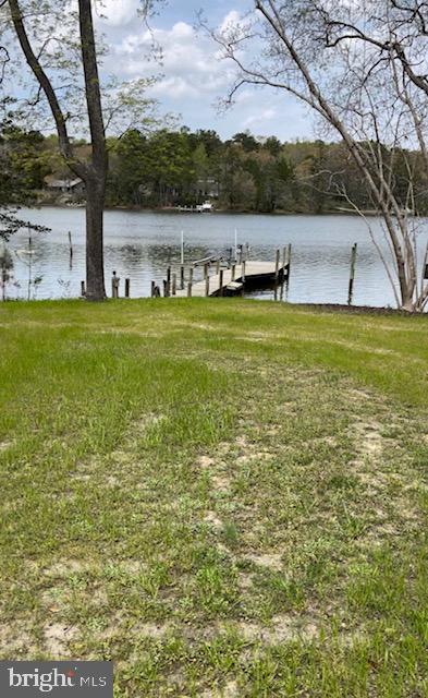 1234 Kelley Neck Road Lancaster, VA 22503 - Photo 64 of 71 a view of a lake with houses in the back