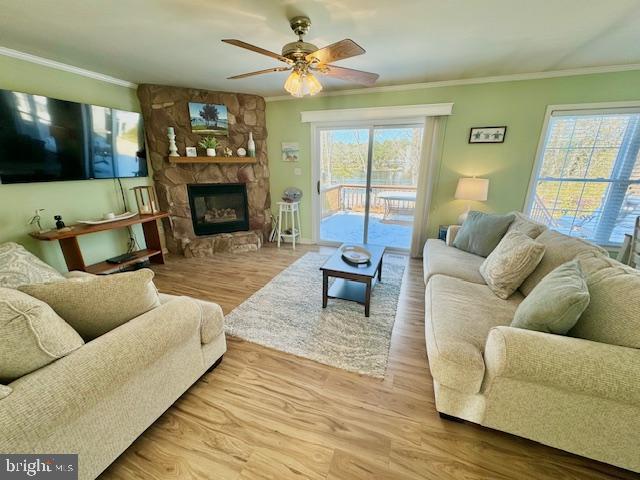 1234 Kelley Neck Road Lancaster, VA 22503 - Photo 8 of 71 a living room with furniture a flat screen tv and a fireplace