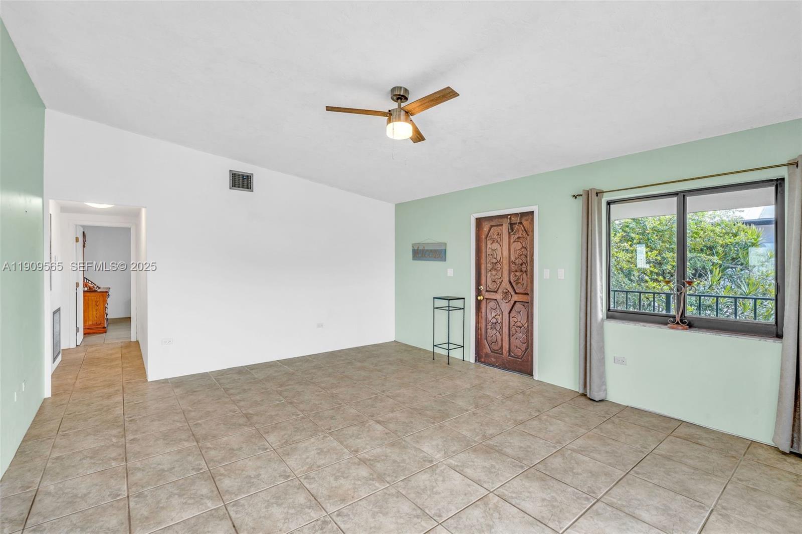 877 Ellen Drive Key Largo, FL 33037 - Photo 12 of 39 a view of a livingroom with a ceiling fan and window