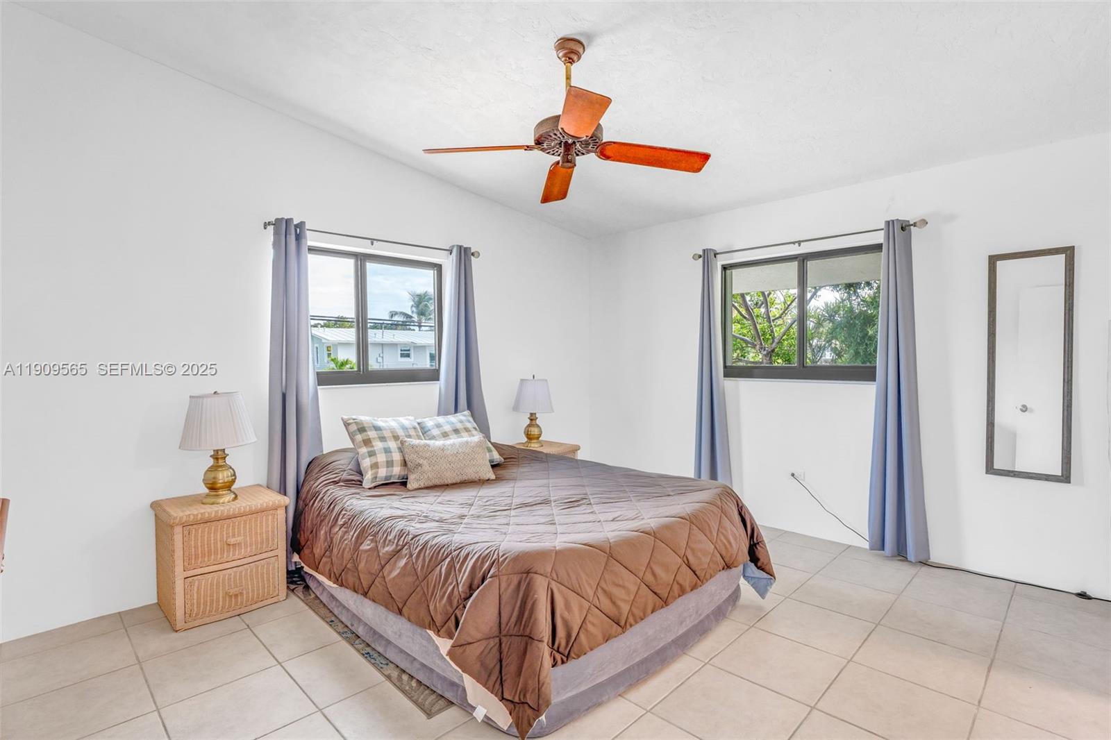 877 Ellen Drive Key Largo, FL 33037 - Photo 13 of 39 a bedroom with a large bed and a window