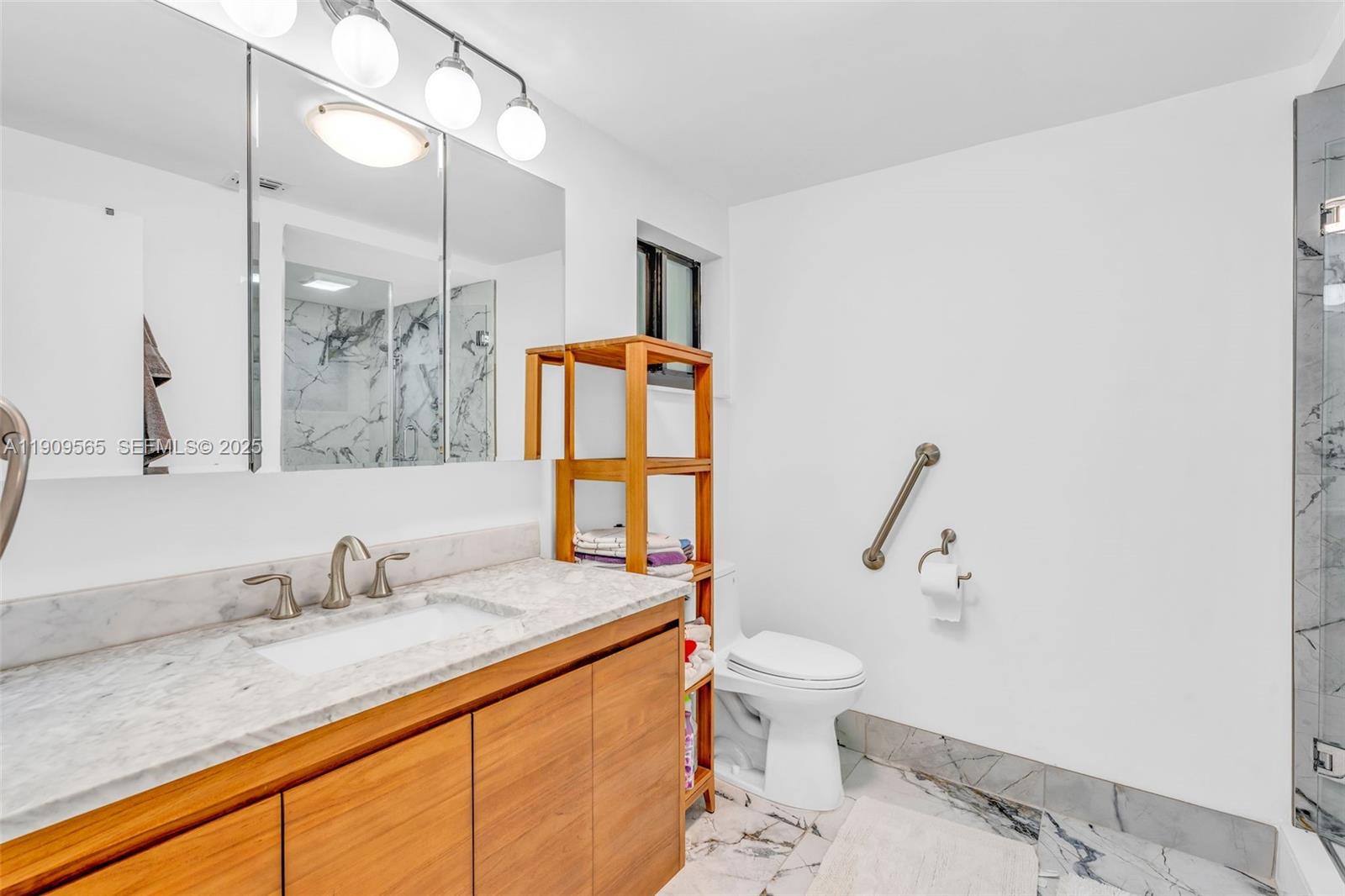 877 Ellen Drive Key Largo, FL 33037 - Photo 15 of 39 a bathroom with a granite countertop sink toilet and shower