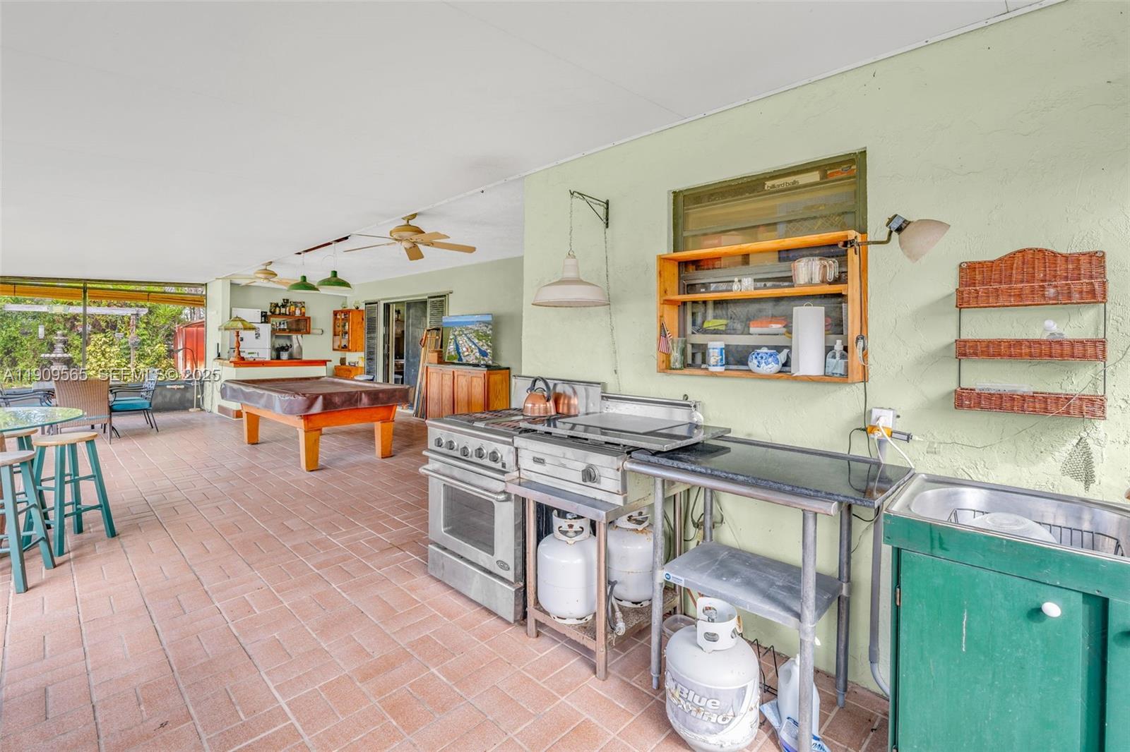 877 Ellen Drive Key Largo, FL 33037 - Photo 27 of 39 a kitchen with stainless steel appliances granite countertop a stove and a sink