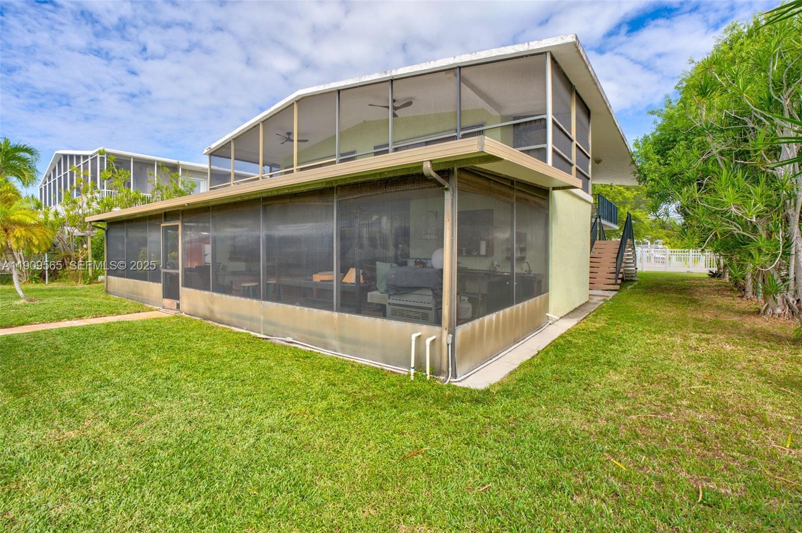 877 Ellen Drive Key Largo, FL 33037 - Photo 29 of 39 a view of a house with a yard