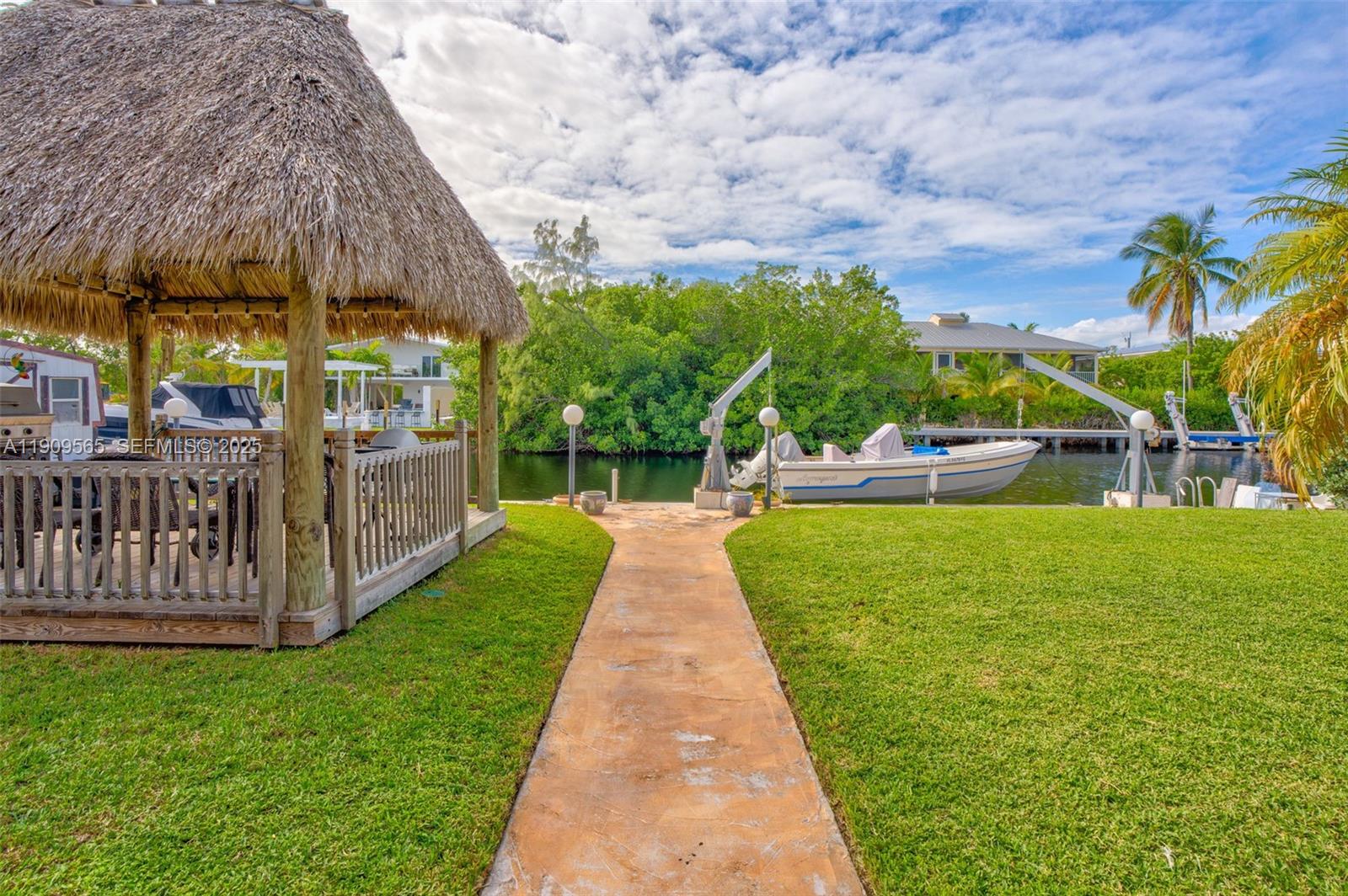 877 Ellen Drive Key Largo, FL 33037 - Photo 30 of 39 a view of swimming pool with brick wall and roof