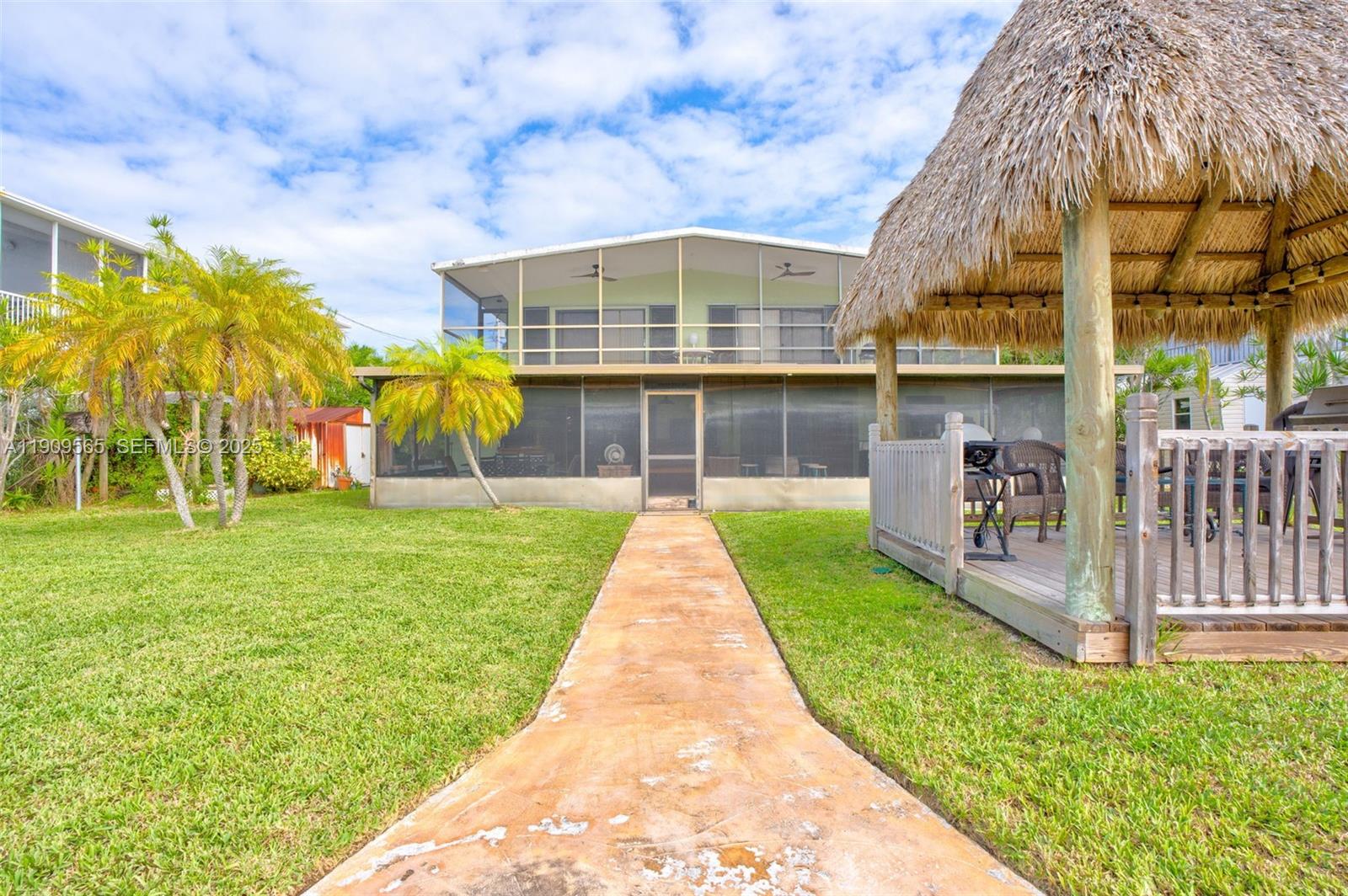 877 Ellen Drive Key Largo, FL 33037 - Photo 32 of 39 a view of a house with a yard