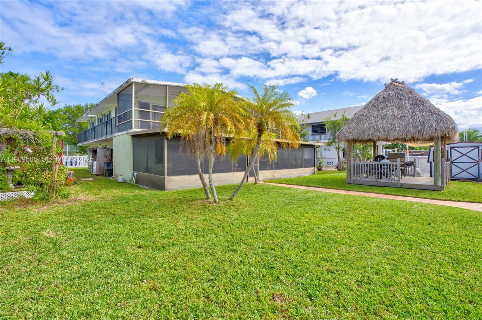 877 Ellen Drive Key Largo, FL 33037 - Photo 33 of 39 a house view with a garden space