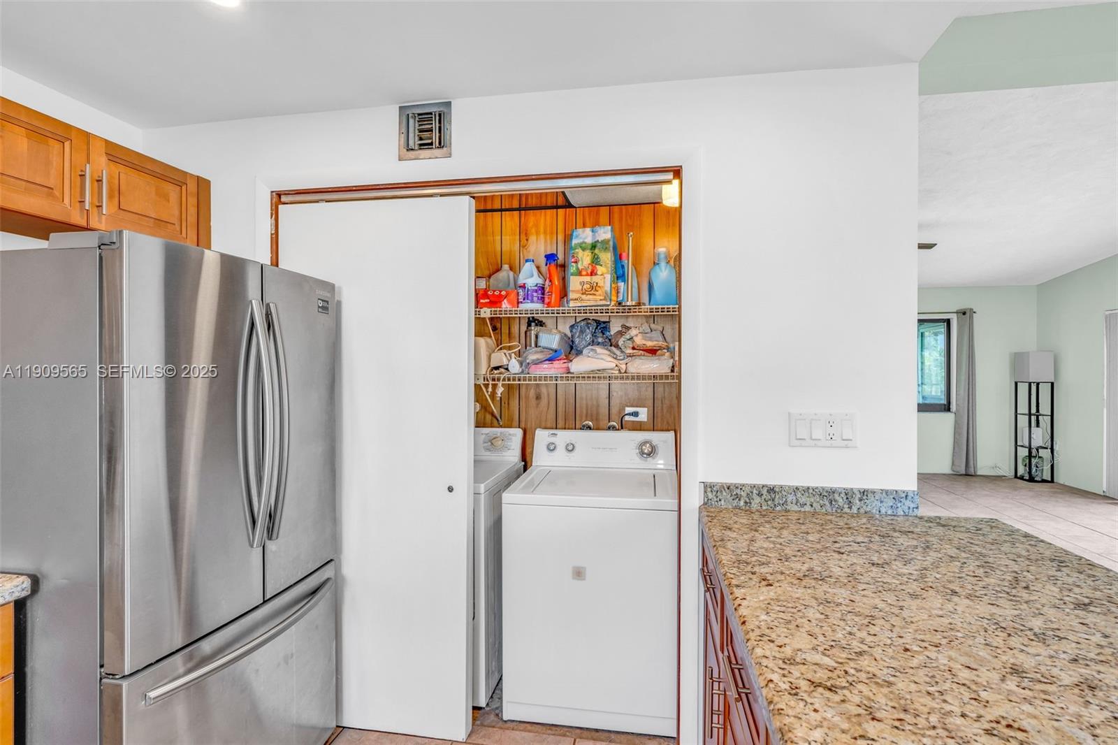 877 Ellen Drive Key Largo, FL 33037 - Photo 9 of 39 a view of a kitchen with a refrigerator washer and a window