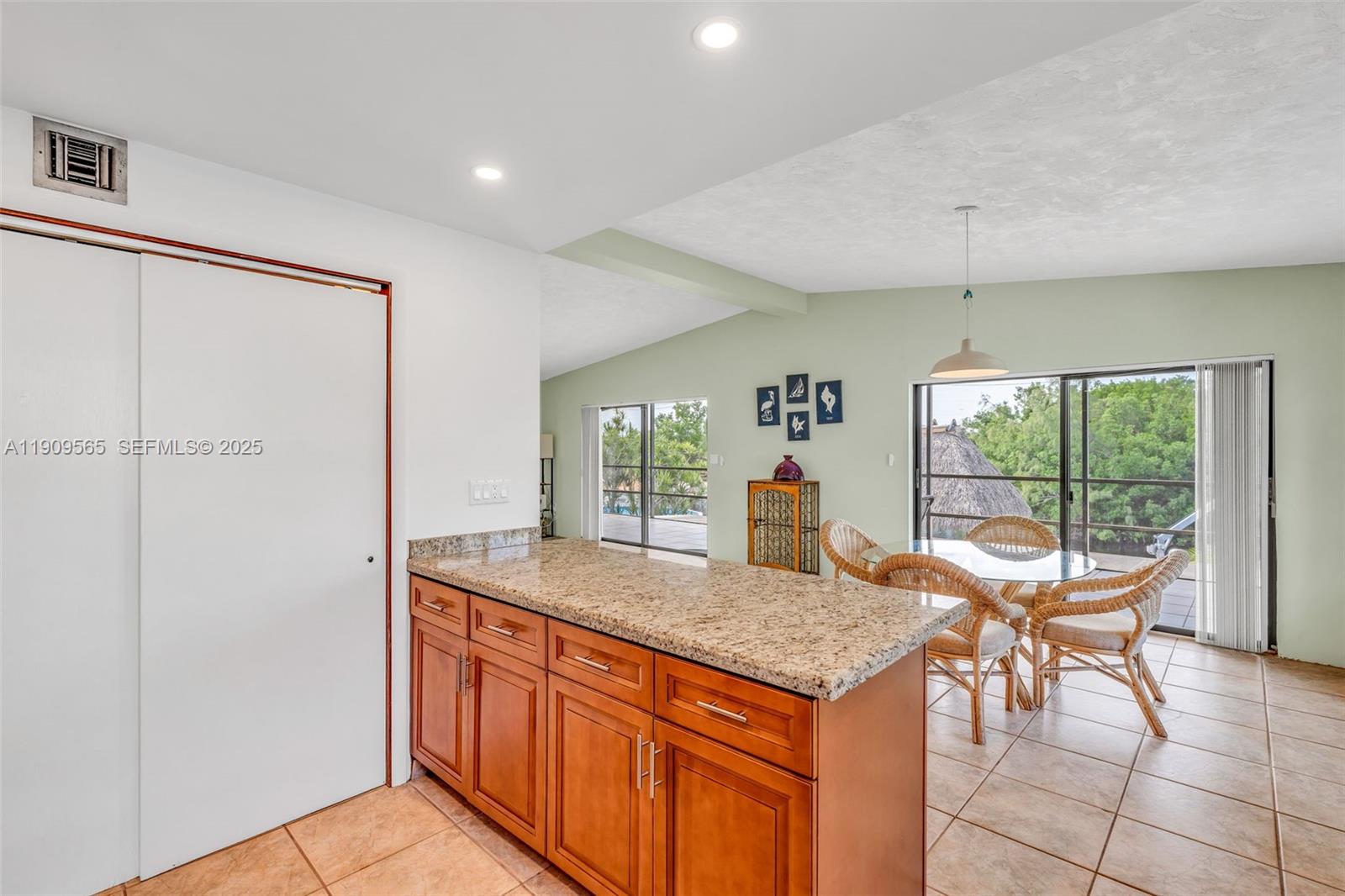 877 Ellen Drive Key Largo, FL 33037 - Photo 10 of 39 a kitchen with granite countertop sink and granite counter top space