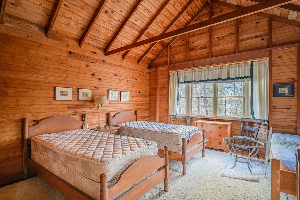 141 Nyes Neck Road Barnstable, MA 02632 - Photo 18 of 31 a bedroom with a bed and wooden floor