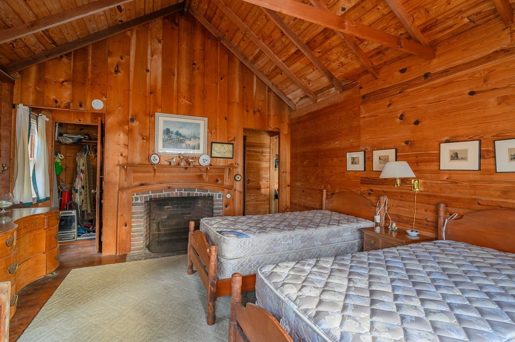 141 Nyes Neck Road Barnstable, MA 02632 - Photo 19 of 31 a bedroom with a bed and dresser